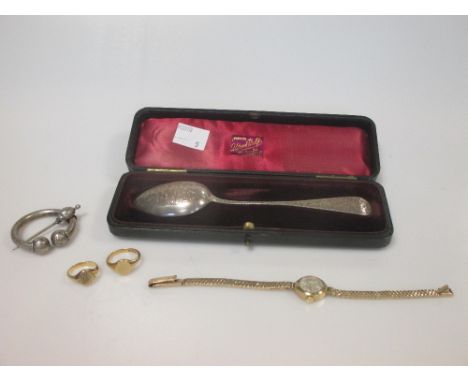 An 18ct gold signet ring and another signet ring which tests for gold, a 9ct gold lady's bracelet watch, a white metal plaid 