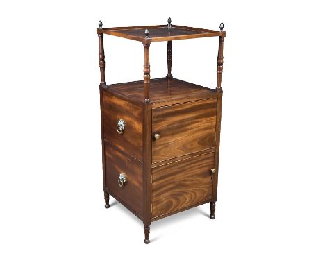 A Regency mahogany whatnot, with an open shelf above two cupboards, the sides with faux drawer fronts, each with brass rosett