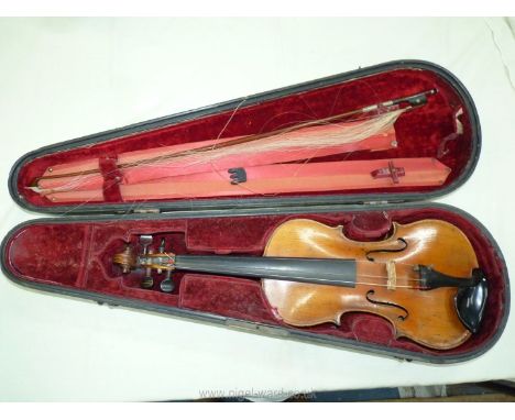 An antique violin having a well-carved scroll and nicely figured body including the back, the main body being 14 3/8" long an