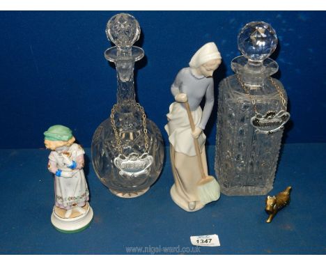 A cut glass whiskey and sherry decanter with stoppers and labels, Spanish figurine of a lady with broom, etc.