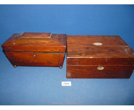 A Rosewood sarcophagus shaped Tea caddy standing on compressed metal bun shape feet, 10 1/2" wide x 5 1/2" deep x 6" high, to