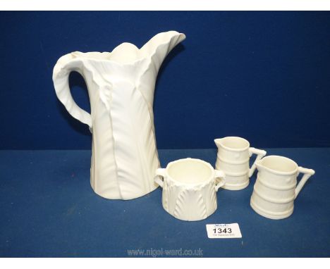 Four pieces of white Royal Worcester including palm leaf jug and sucrier and two small cream jugs in banded wood effect