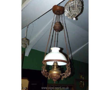 A large ceiling hanging oil Lamp converted to electric having Art Deco design with a white glass shade (a/f).