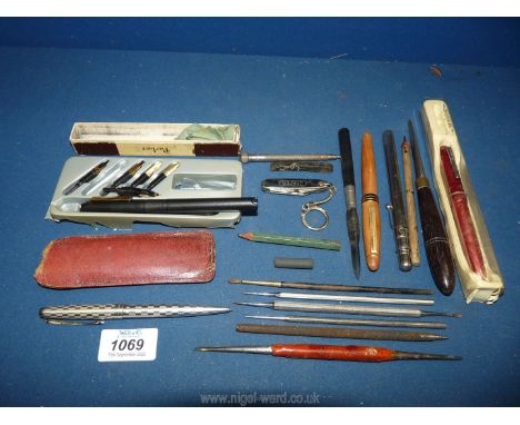 A Platignum pen with various nibs, an Osmiroid ink pen, etc.