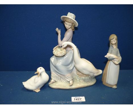 Two Lladro figures, one of a lady sitting with a basket on her knee and the other of a girl holding a piglet plus a Nao figur