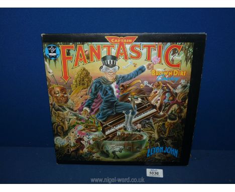 A first press Elton John L.P. 'Captain Fantastic' with lyrics.