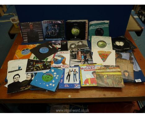 A quantity of 45 RPM's to include; Beatles, Elvis Presley, Michael Jackson poster editions, etc.