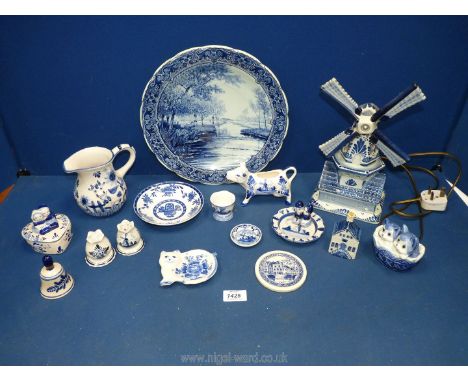 A quantity of Delft ware china including windmill lamp, salt &amp; pepper, KLM Royal Delft house, trinkets etc.