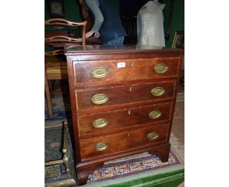 A diminutive and appealing Mahogany and Walnut, oak carcassed Chest of four long Drawers having crossbanded details and light