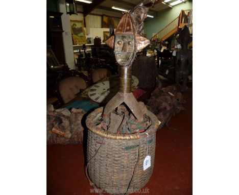 A Tribal Art Kota Mahongwe reliquary figure with basket (metal sheathing slightly weathered) having smooth patina to the neck