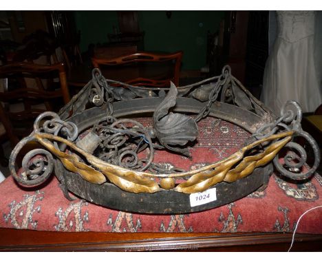 A brass and iron hanging lamp with leaf decoration, four bulb fittings, a/f., 19" diameter.