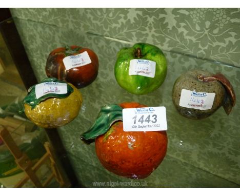 Five ceramic fruits including lemon and mango