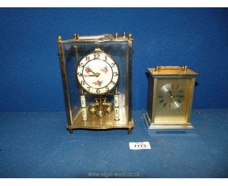 A quartz carriage clock in brass, 5" tall and a Kieniger and Obergell German rose design anniversary glass clock (needs servi