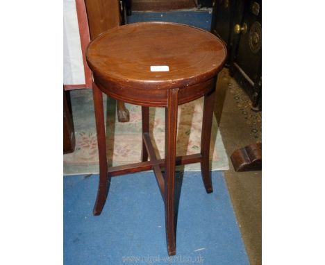 An Edwardian Mahogany occasional/lamp Table having lightwood stringing, the swept legs united by a cross stretcher, 12 1/2'' 