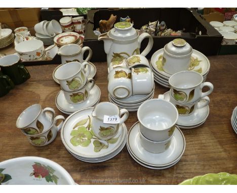 A quantity of Denby Troubadour pottery including 11 tea cups, 10 matching saucers, a coffee cup, coffee pot, sucrier, milk an