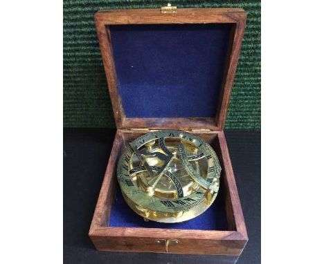 A brass ship's compass in mahogany and brass inlaid box