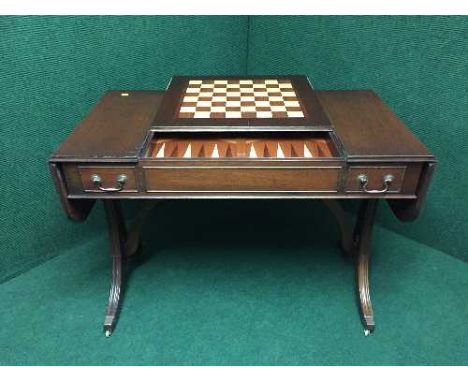 A mahogany drop end sofa table with chess board top with a backgammon board 