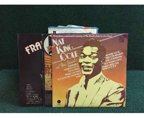 A box of lps, Bing Crosby, Nat King Cole together with a quantity of 45's, Rod Stewart, Rolling Stones etc