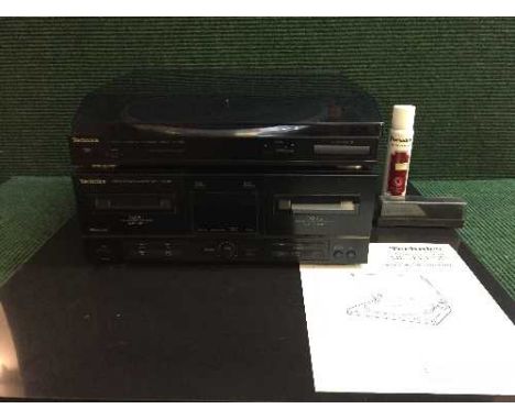 A Technics automatic turn table, model SL-J110R together with a Technics double cassette deck, model RS-X120