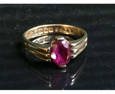 An 18ct gold synthetic ruby set ring   CONDITION REPORT:  Description changed gemstone re-catalogued.