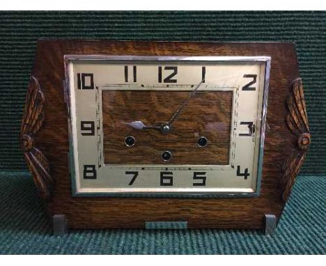 An oak Art Deco mantle clock with key