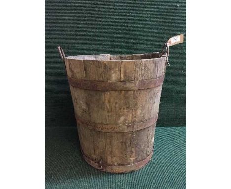 An antique metal bound wooden planter 