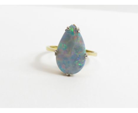 An opal doublet single stone ring, unmarked, finger size M, 2.3 g gross, cased