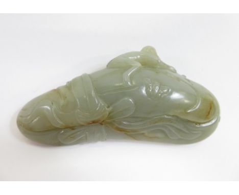 A Chinese jade carving of a vegetable with a monkey and two butterflies, 10.3cm long