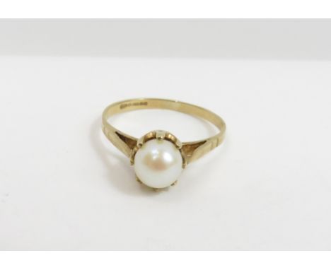 A 9 carat gold single stone cultured pearl ring, the pearl approximately 5 mm in diameter, finger size N, 1.7 g gross