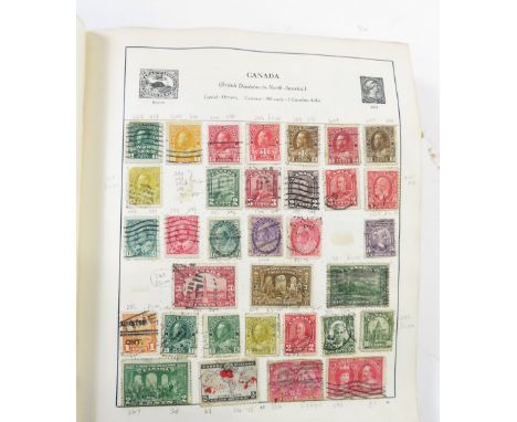 A collection of eight world and commonwealth stamp albums
