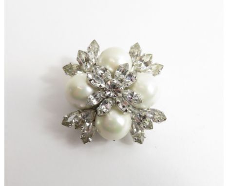 Christian Dior, a simulated pearl and paste set brooch, tagged 'Christian Dior', copyright symbol, and 1959, approximately 4.