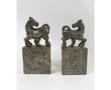 A pair 20th century Chinese hardstone seals each with horse finial - 17cm high