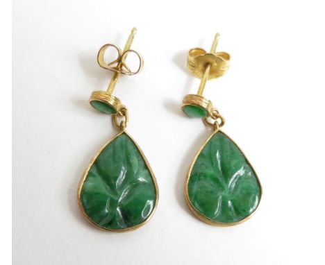 A pair of Chinese green Jade earrings set in yellow metal mount