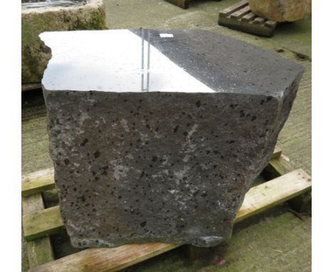 A large granite boulder table with polished top 50cm high