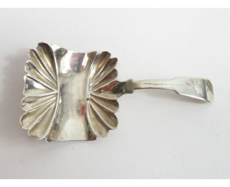 A George IV silver caddy spoon, by James Collins, Birmingham 1826, the rectangular fluted bowl to a monogrammed fiddle patter