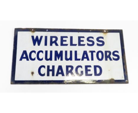 A double sided enamel sign “Wireless accumulators charged” H 45.5cm, 91cm long