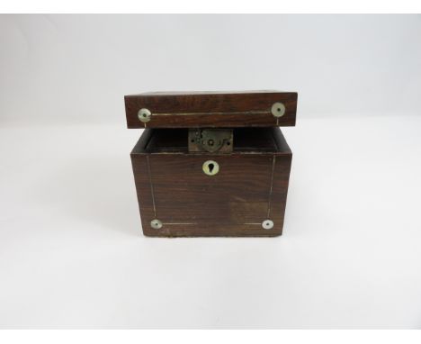 A 19th century rosewood tea caddy with various coins 
