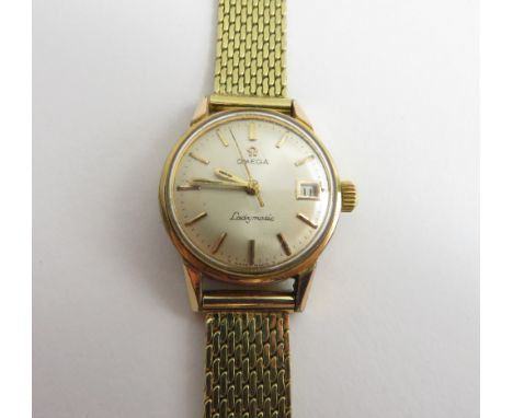 Omega, Ladymatic, a lady's automatic wrist watch, the circular white dial with gilt black batons, hands and black sweep secon