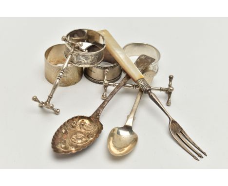 A BAG OF ASSORTED SILVER ITEMS, to include a pair of silver knife rests, hallmarked Chester, an embossed old English pattern 