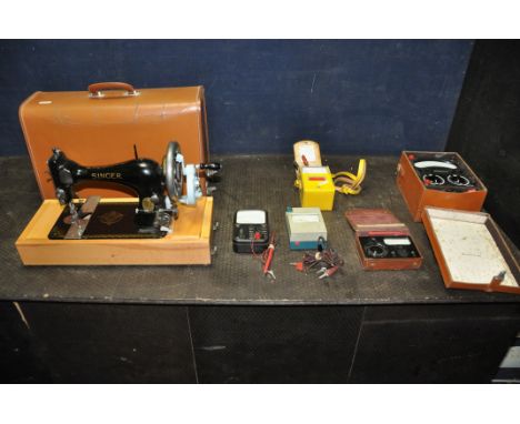 A LEATHER CASED MANUAL SINGER SEWING MACHINE, serial number 15 040 687, an Avometer 8 in original case, and four other variou
