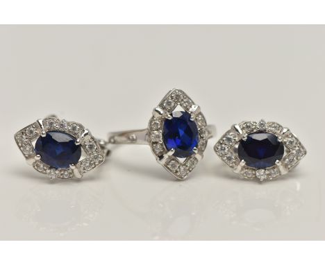 A WHITE METAL RING AND EARRINGS, the ring of a marquise shape, set with an oval cut synthetic blue sapphire, in a surround of