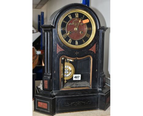 A VICTORIAN FRENCH SLATE MANTEL CLOCK, with red marble inlay, black enamel dial, gilt Roman numerals, original bevelled glass