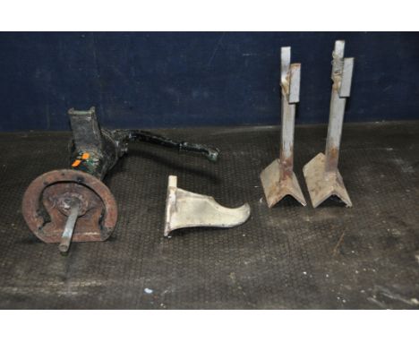 A VINTAGE CAST IRON PUMP, two bespoke metal stands, and a cast metal wall hanging item, labelled 7 1/2 (condition: pump seize