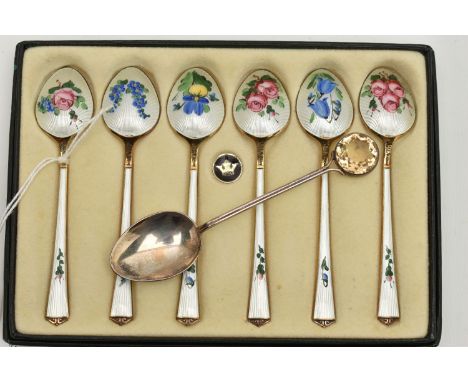A BOXED SET OF SIX NORWEGIAN SILVER GILT AND ENAMEL COFFEE SPOONS, the back of each bowl and handle painted with flowers, sta