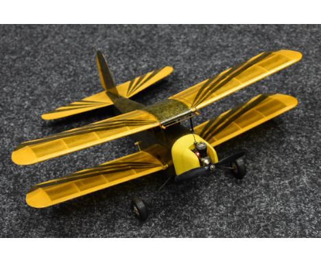 A Radio controlled balsa wood and paper Twin wing Tiger Moth style Airplane, mottled grey and yellow fuselage, sunburst strip