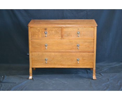 A mid 20th century light oak chest of drawers.
