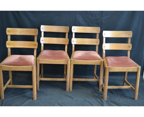 A set of four light oak ladder back dining chairs