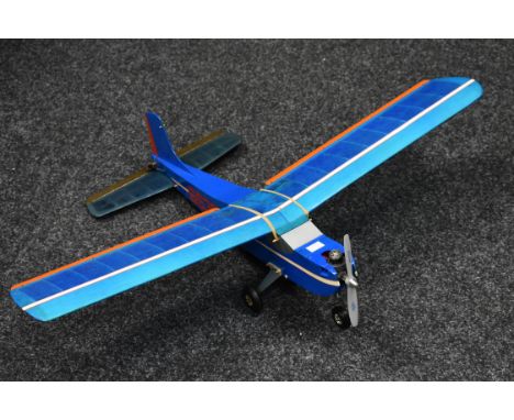 A Radio controlled balsa wood and paper single wing Airplane, blue fuselage, orange and white detailing, petrol engine, 62cm 