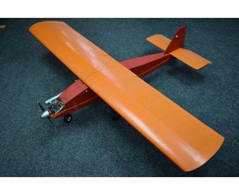 A Radio controlled hand made single top wing Airplane, orange and red wooden painted fuselage, Futaba Fp-R129P dual conversio