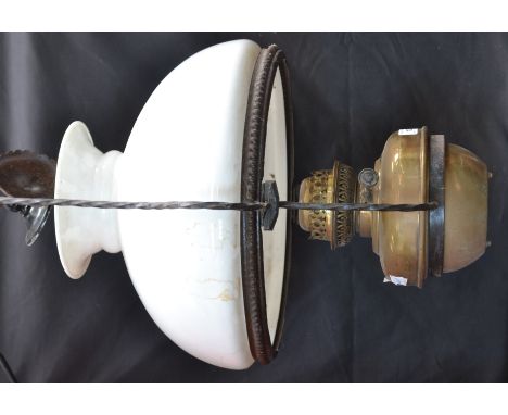 A Victorian hanging oil lamp with opaque glass shade